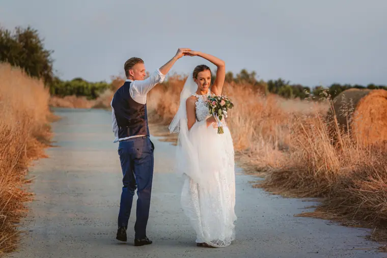 Charlene and Ben dancing on a quiet road at golden hour, Liopetro, Kouklia