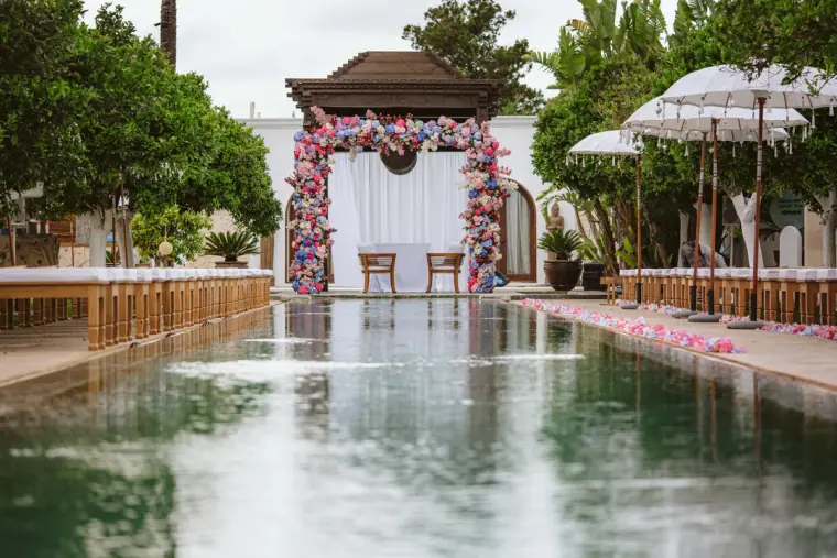 Long reflecting pool leading to a floral ceremony pavilion at Atzaro, Ibiza