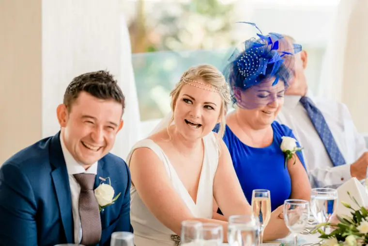 Francesca and Stephen laughing at the top table during the speeches