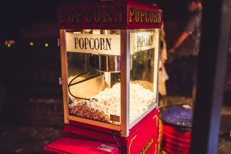 Red vintage popcorn machine glowing in the dark