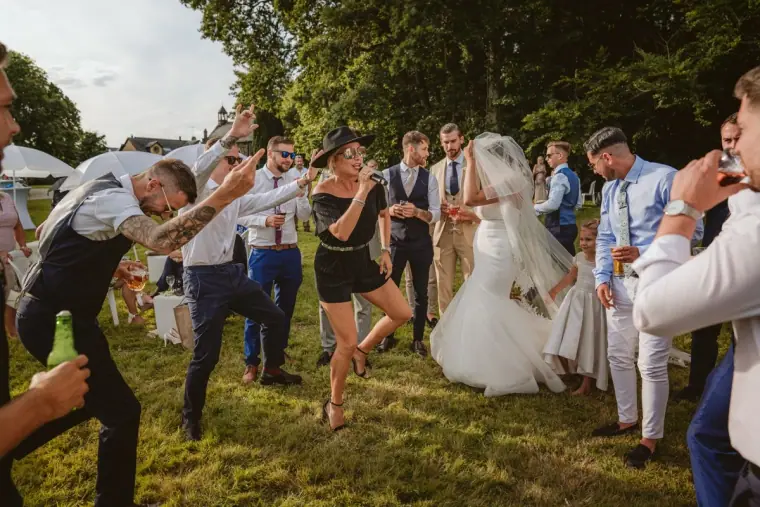 Lauren dancing with guests on the lawn at Château de la Basmaignée, France
