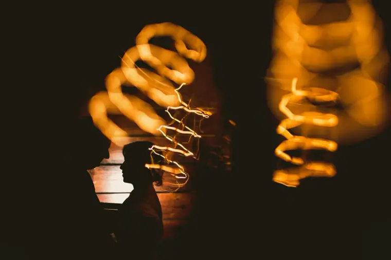 Glowing spiral filament bulbs against a dark background, Lexeko Estate
