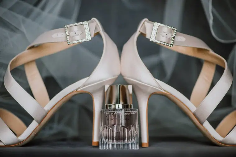 Ivory strappy bridal heels framing a perfume bottle at Galu Seaside, Larnaca