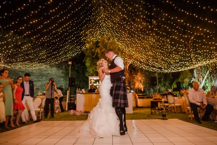 Nicole and Craig's first dance under a canopy of fairy lights at Hadjiantonas Winery, Limassol