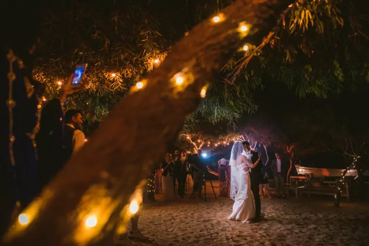 First dance under a tree strung with lights at a night-time reception, Ayia Napa