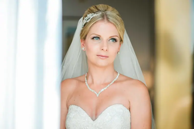Portrait of Charlotte in her veil, tiara and sparkling necklace