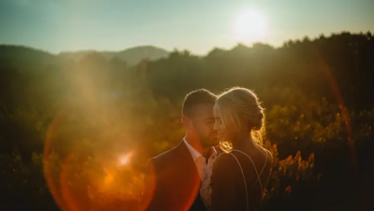 Sophie and Iain cheek to cheek as the sun sets over the hills at Can Gall, Ibiza