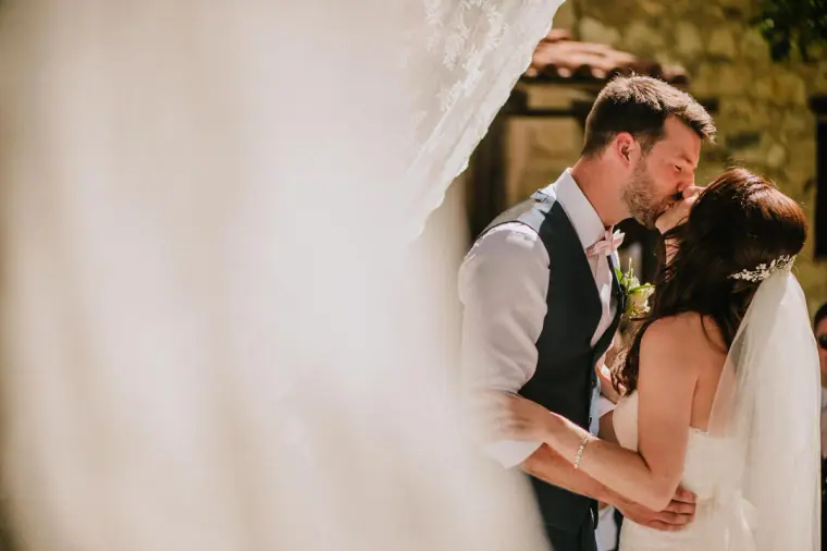 Claire and Sean's first kiss as newlyweds under the arch