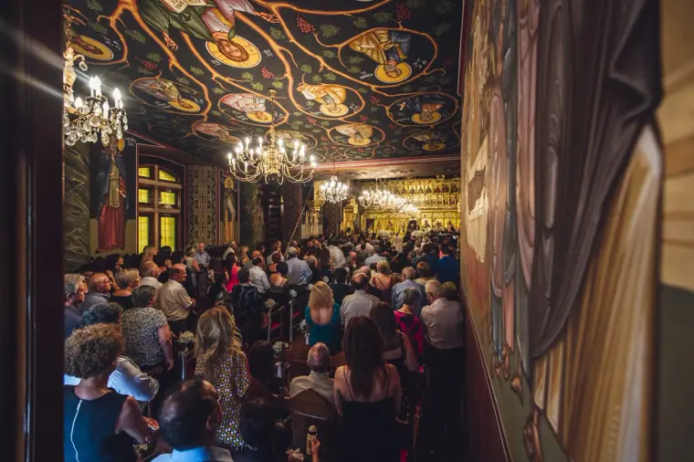 Congregation filling the ornately painted Orthodox church