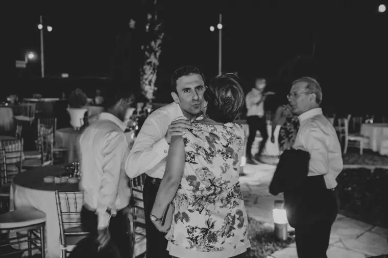 Black-and-white photo of guests dancing late into the night