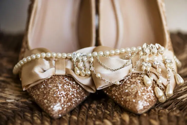 Glitter wedding heels with satin bows and a pearl-and-crystal headpiece