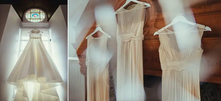 Diptych of the wedding gown and bridesmaid dresses hanging in front of arched windows