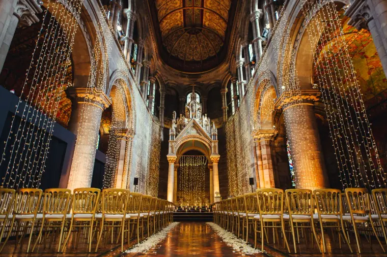 Gothic interior of Mansfield Traquair with gold chairs and curtains of fairy lights