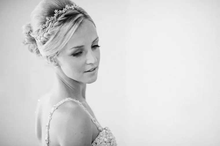 Black-and-white portrait of Emmee wearing a sparkling tiara and beaded gown