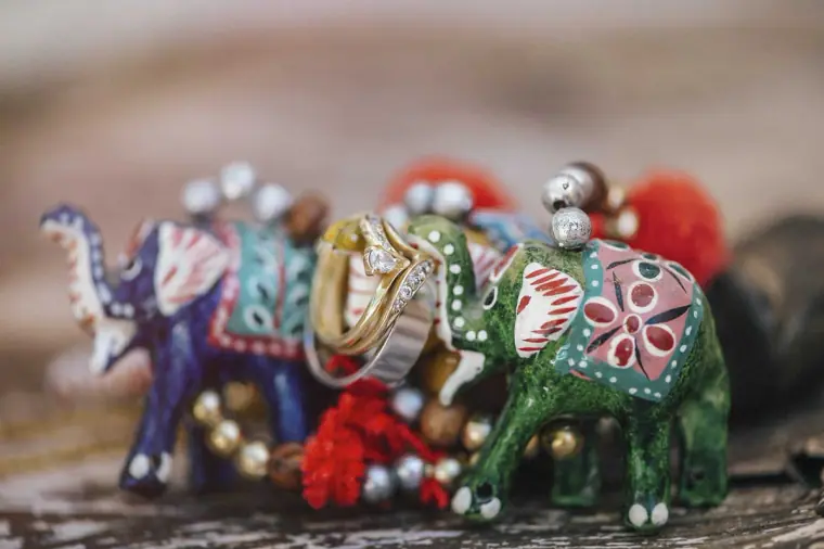 Colourful painted elephant ornaments with the wedding rings