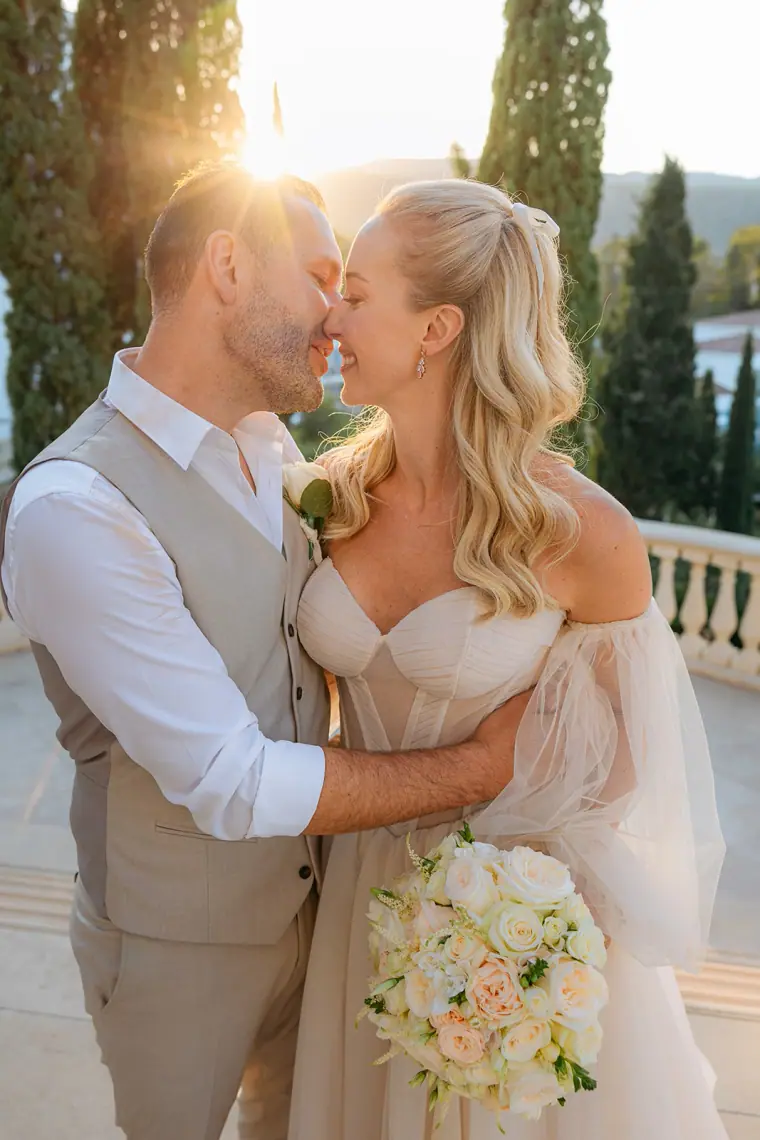 Peter kissing Jade's forehead as the evening sun glows behind them