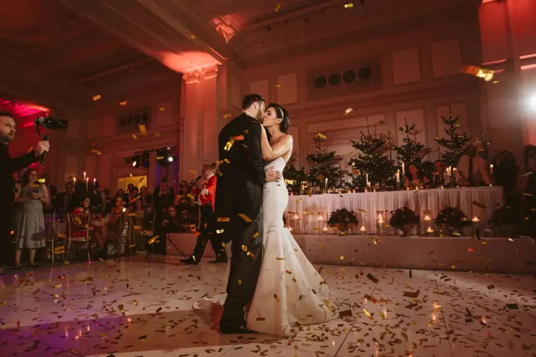 Stephanie and Jamie's first dance among scattered petals in the ballroom