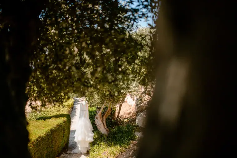 Wedding dress hanging from a tree branch in the hotel gardens at Laura Beach Hotel, Paphos