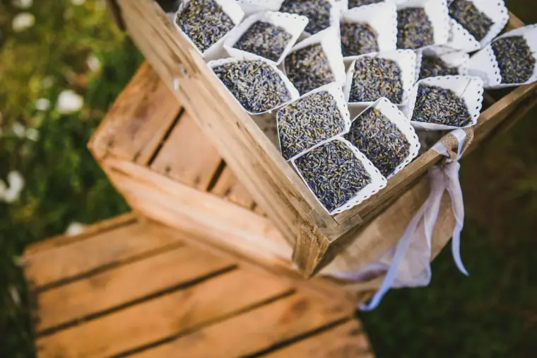 Wooden crate filled with lavender favour bags