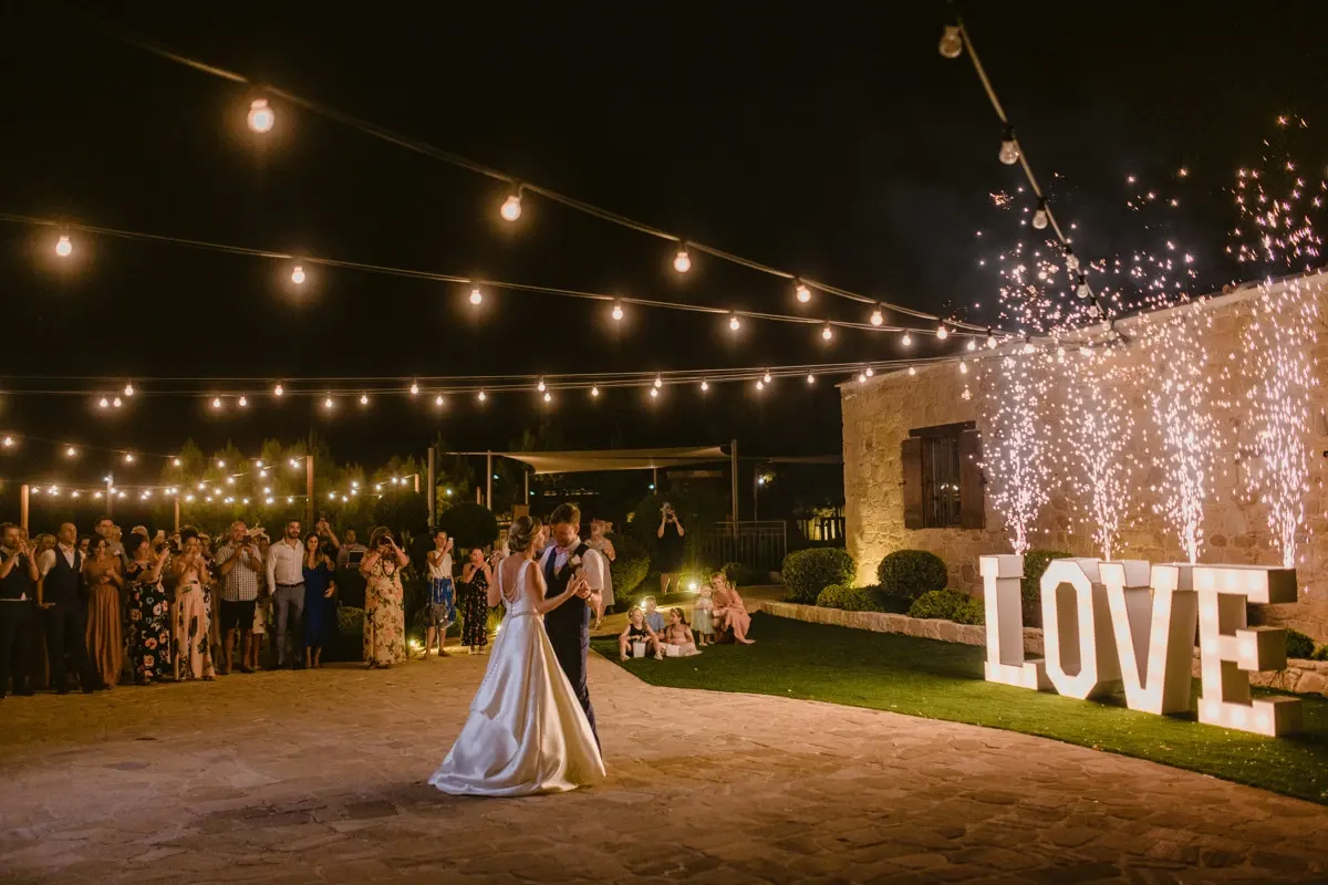 Nicola and Joel's first dance with sparklers and a light-up LOVE sign at Liopetro, Kouklia
