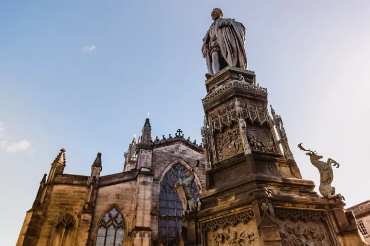 Statue on a carved plinth in front of St Giles' Cathedral, Edinburgh