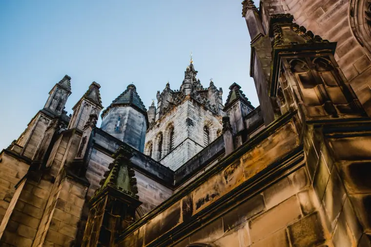 Ornate Gothic stonework and towers seen from below in Edinburgh's Old Town