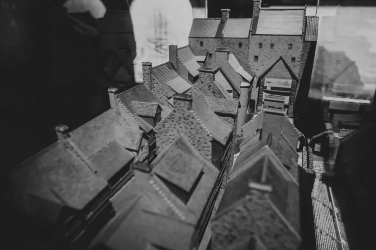 Black-and-white close-up of a miniature model of old Edinburgh rooftops