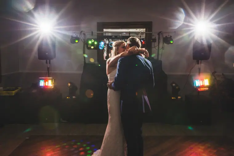 First dance under bright stage lights and coloured disco lights