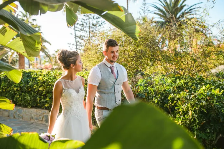 Naomi and Dale strolling through tropical gardens at Nissi Beach Resort
