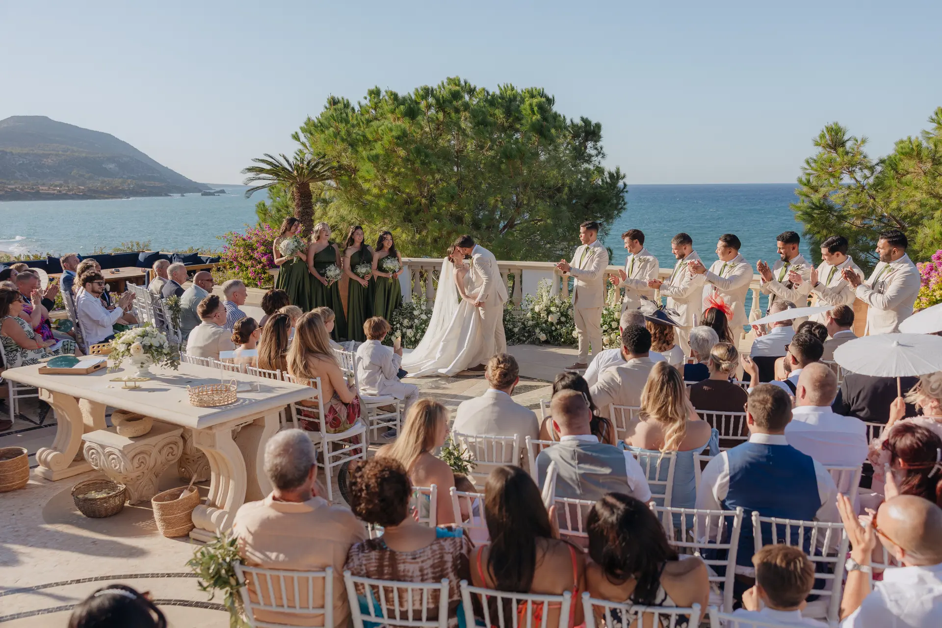 Guests watching the ceremony on Anassa's terrace overlooking the sea