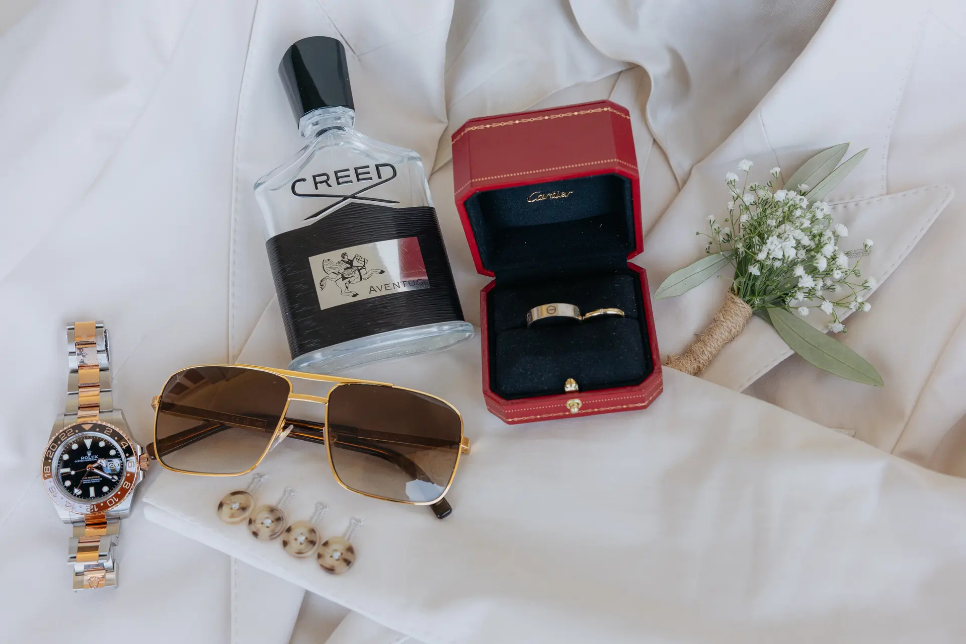 Groom's details: Creed cologne, Cartier ring box, watch, sunglasses and cufflinks