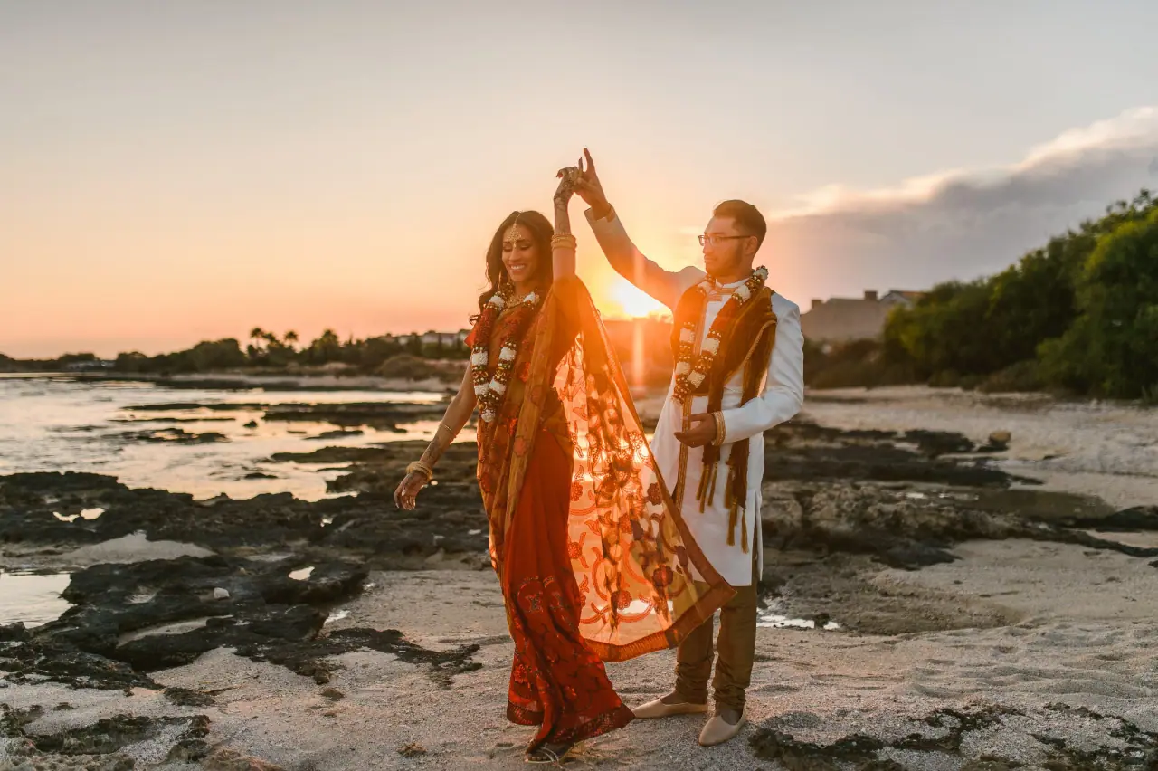 Raya and Adhib dancing on the rocky shoreline at sunset, Thalassines Beach Villas, Ayia Napa