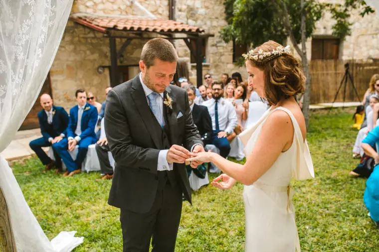 Kazem placing the ring on Fleur's finger in the garden at Vasilias Nikoklis Inn