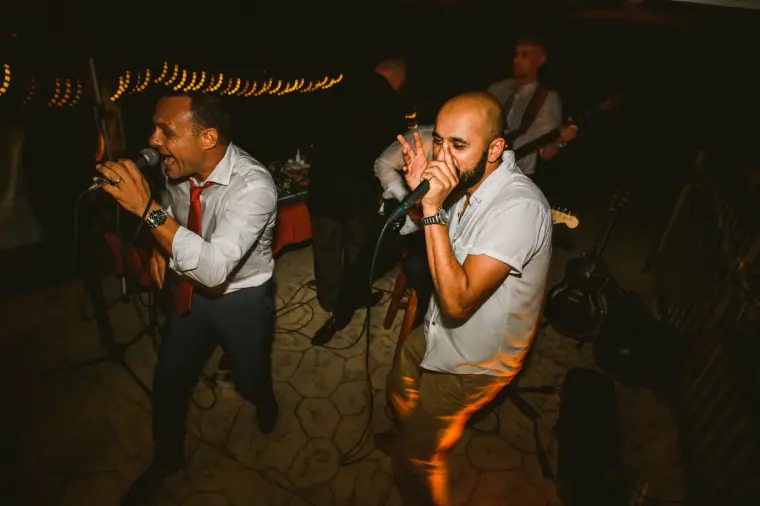 Live band singers performing on stage at the evening reception
