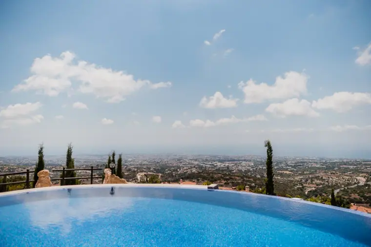 Infinity pool overlooking the Paphos coastline at Minthis Hills