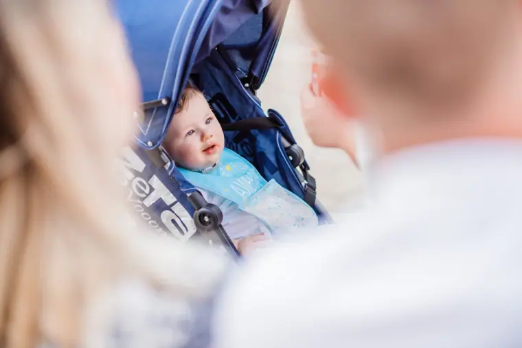 Baby in a pushchair watching the ceremony preparations