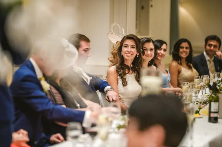 Elina and guests laughing during the speeches