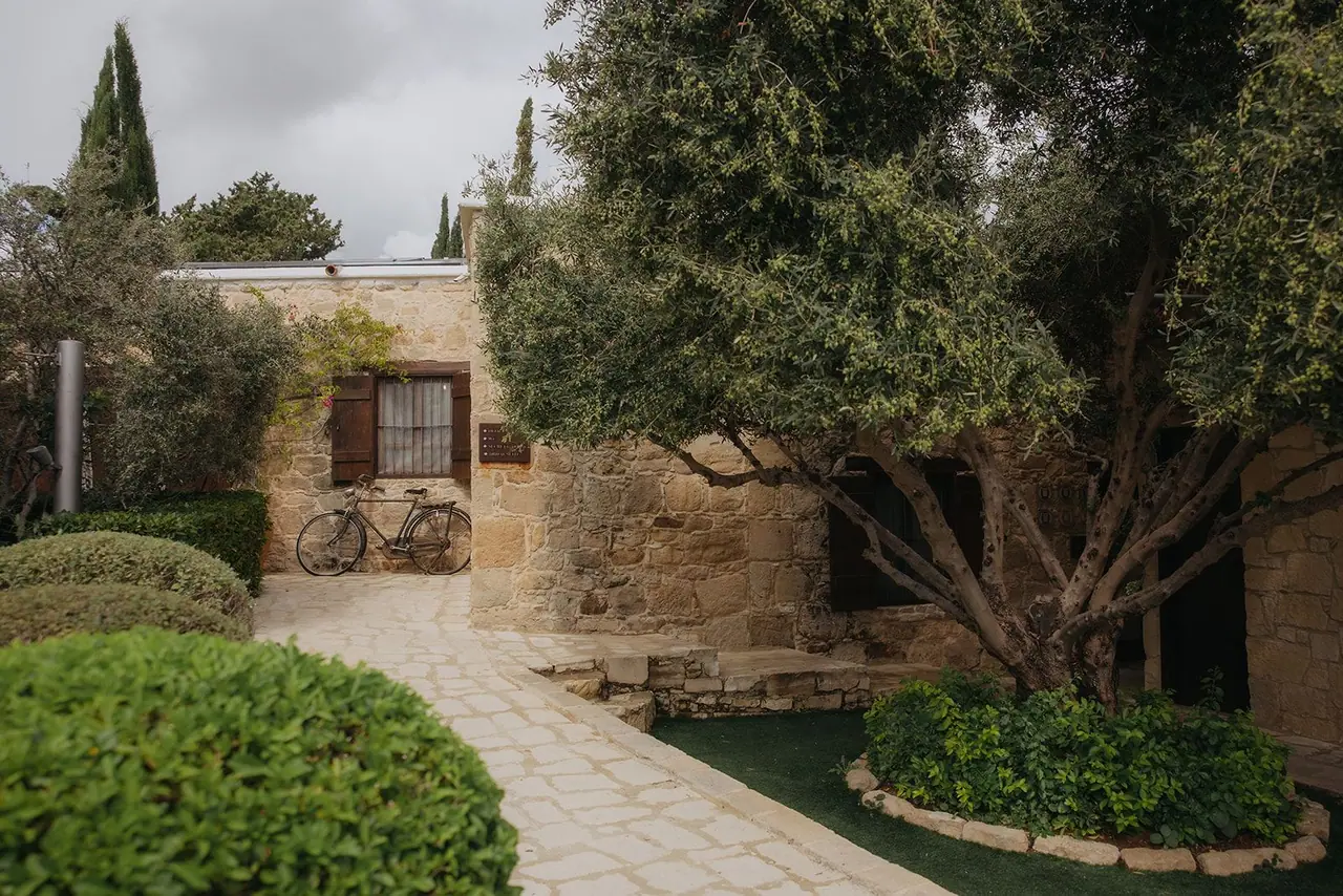 Topiary gardens and stone cottage at Liopetro wedding venue on the morning of the wedding