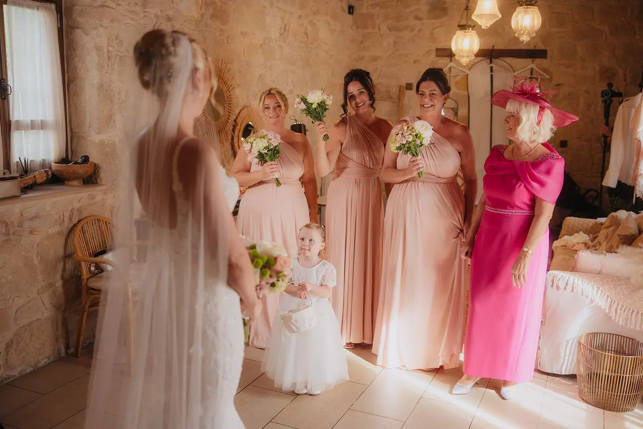 Bridesmaids and Zoe's mum reacting to seeing the dress at Liopetro