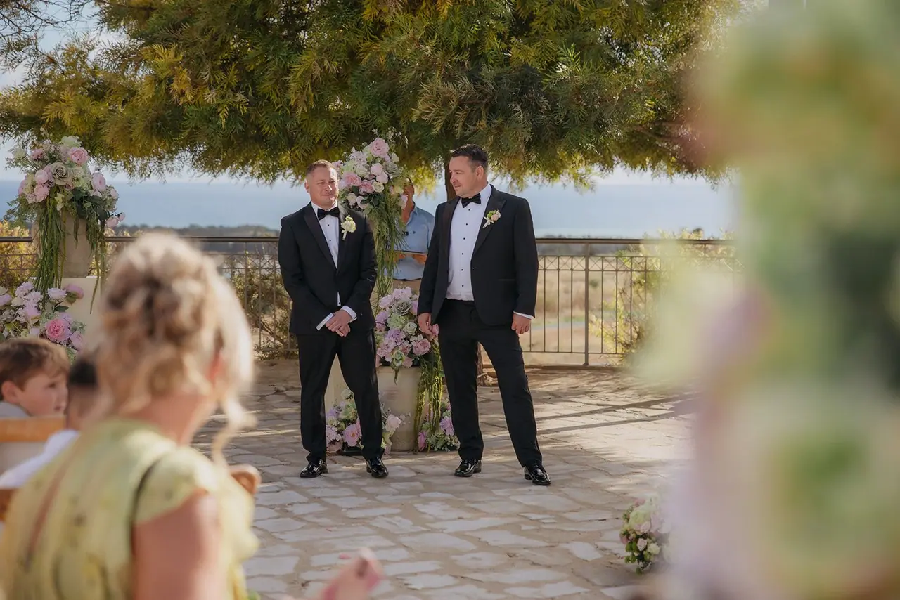 Oliver watching Zoe walk down the aisle