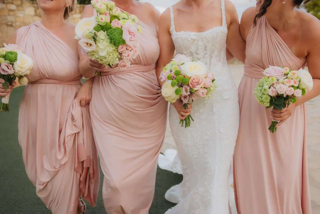 Zoe and her bridesmaids together with their bouquets