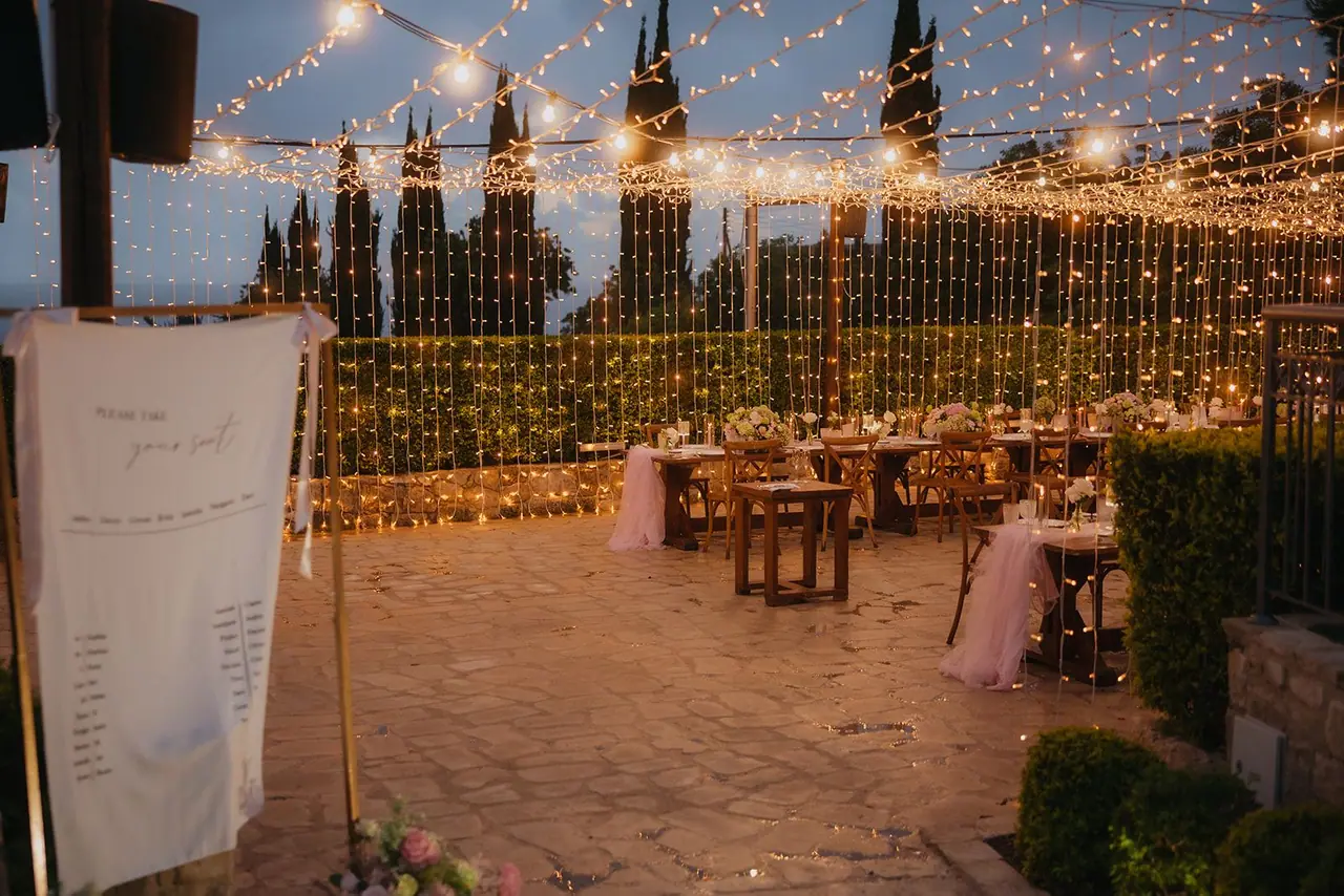 Reception terrace at Liopetro with walls of fairy lights and the seating plan