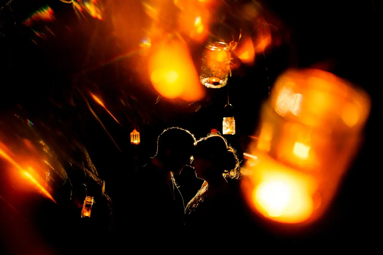 Raya and Adhib kissing among glowing hanging lanterns, Thalassines Beach Villas, Ayia Napa