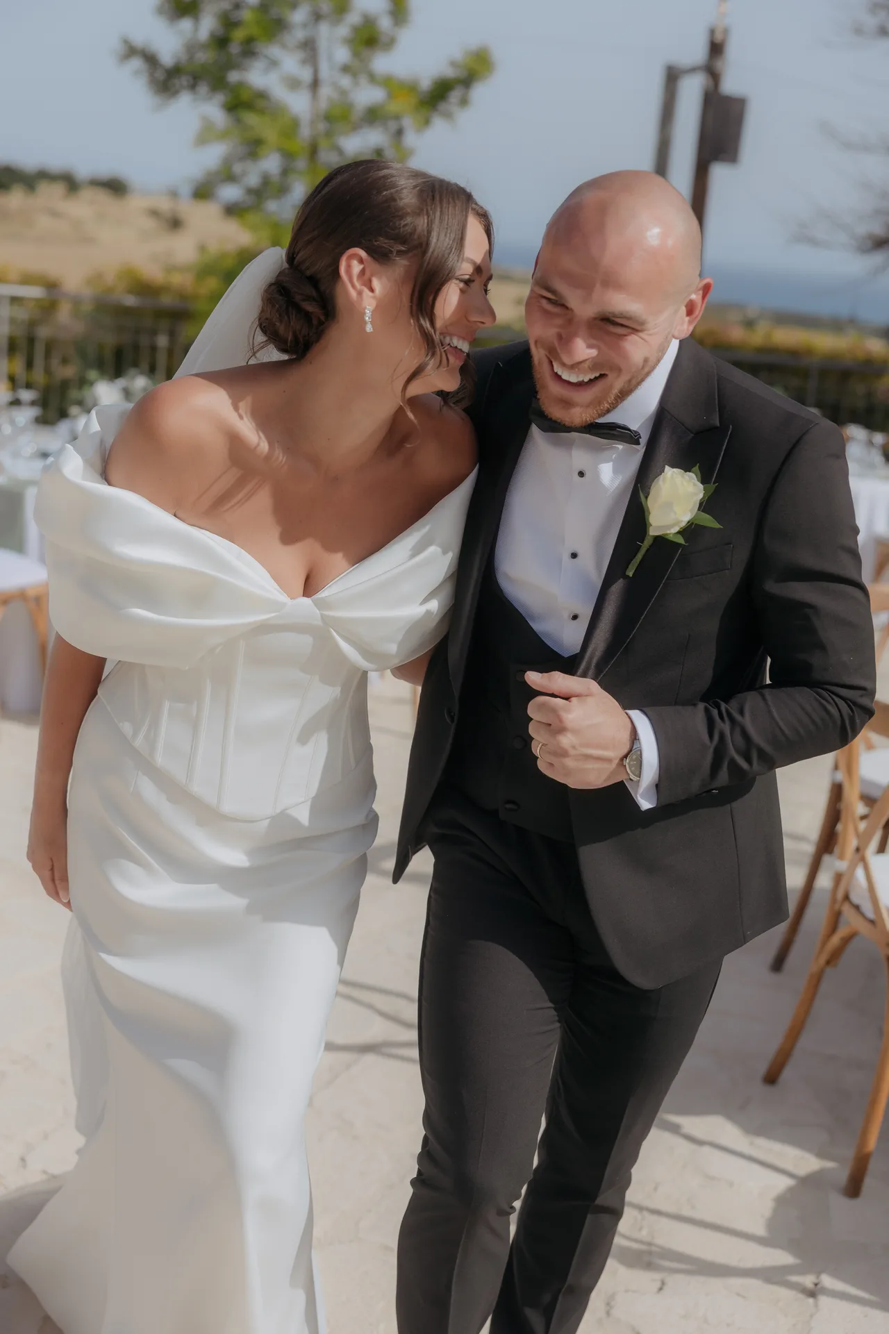 Bride and groom laughing together on the terrace at Liopetro, Kouklia, Paphos