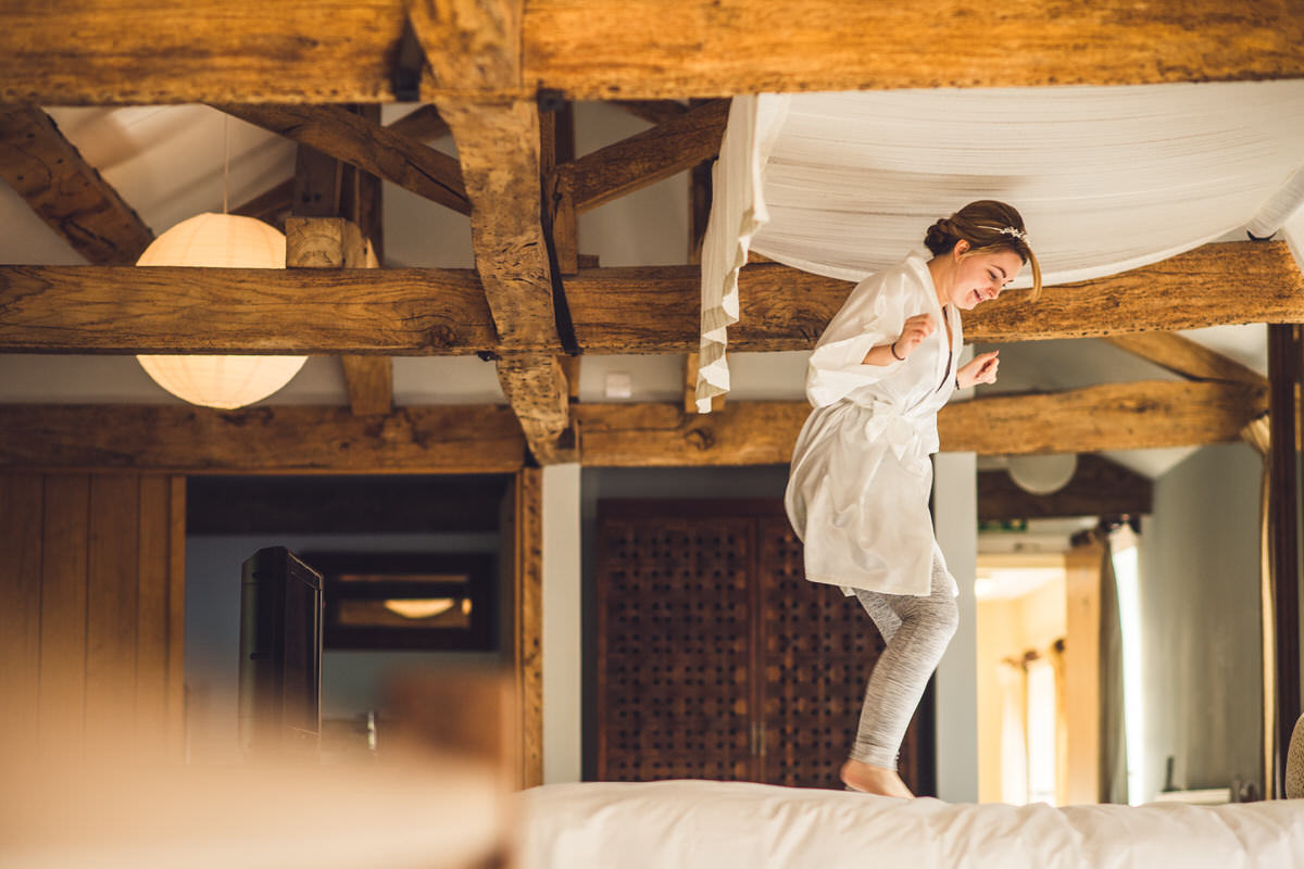 bride bouncing on bed