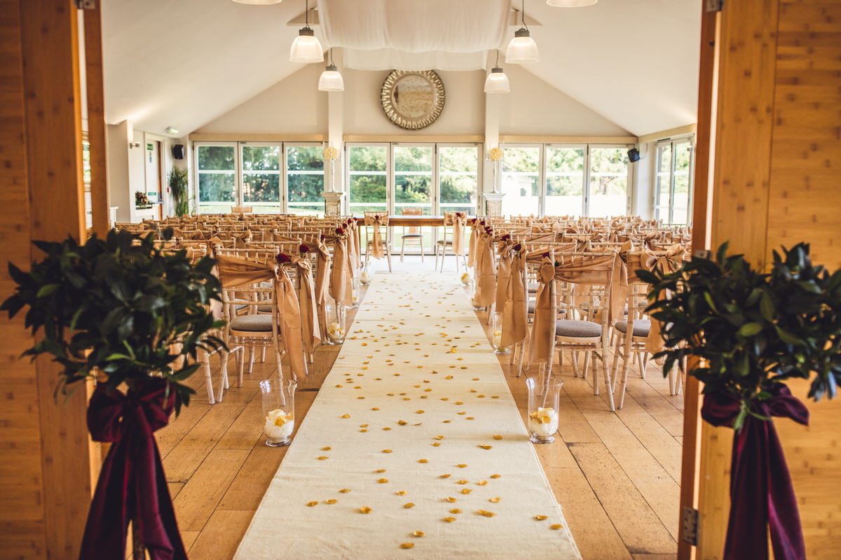 elegant gold red and cream decor ceremony room