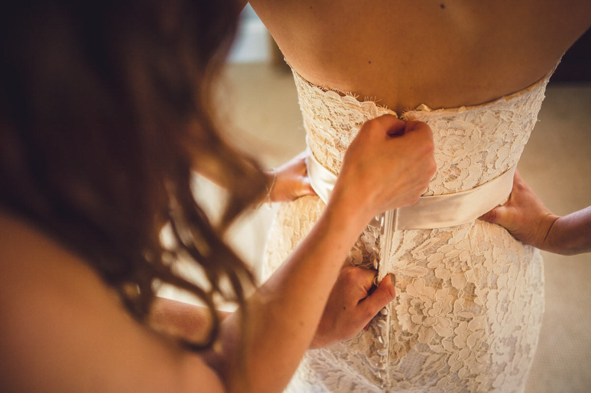 zipping up the back of the dress
