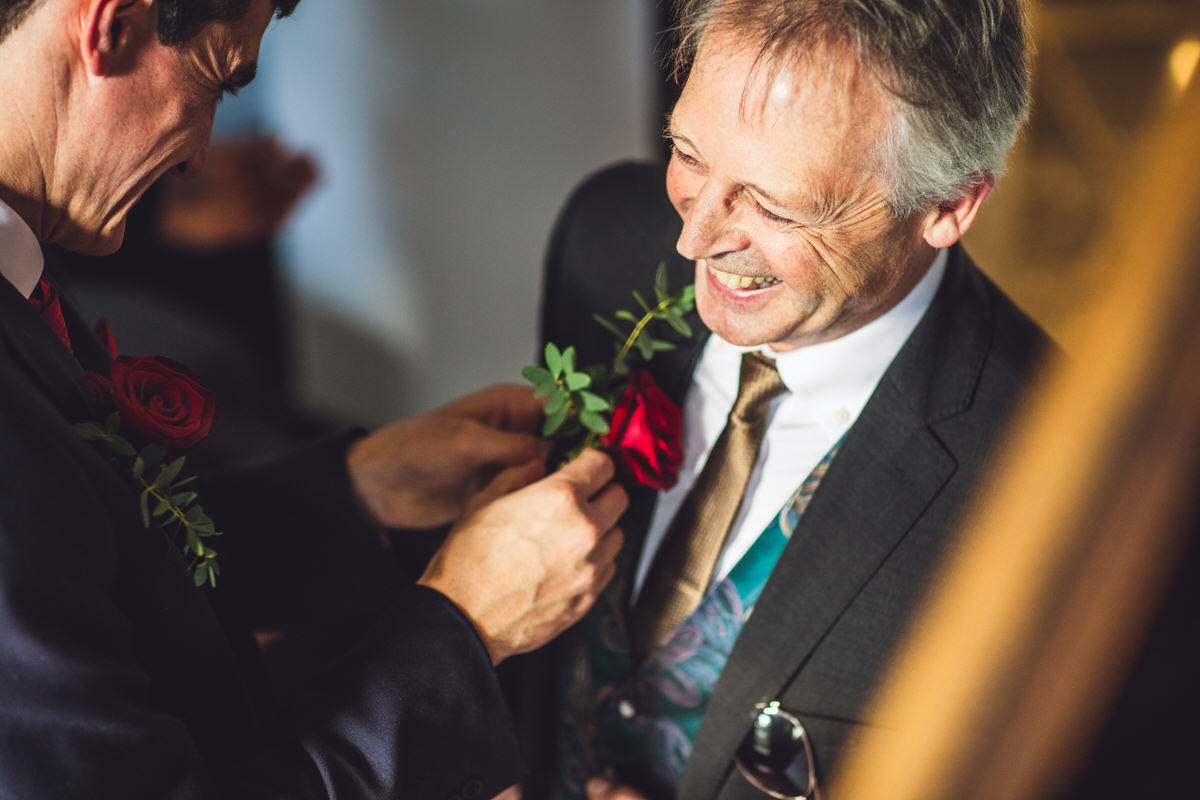 buttonhole red roses