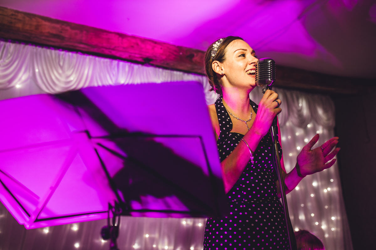 singer under pink light