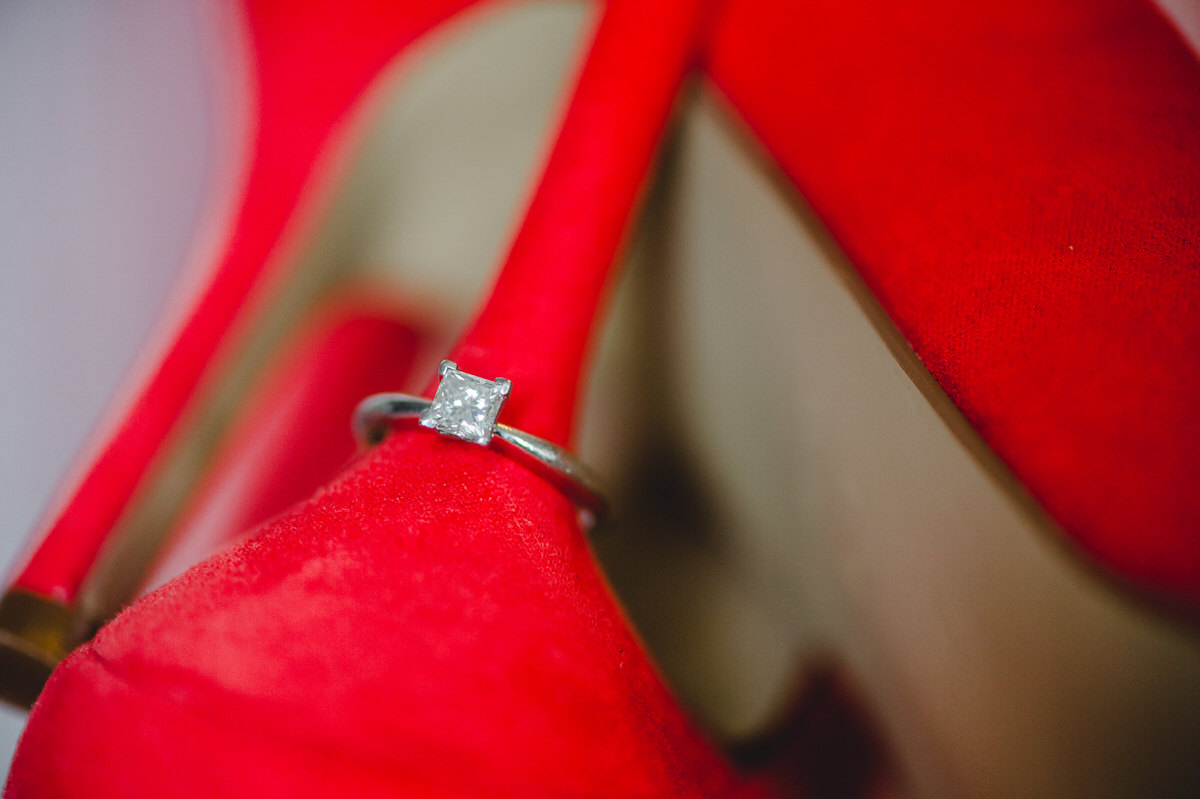 engagement ring on heel of wedding shoe